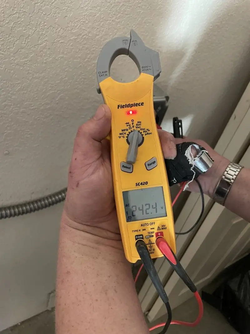 Voltage testing with clamp meter during Electrical Installation Services in Valley Park